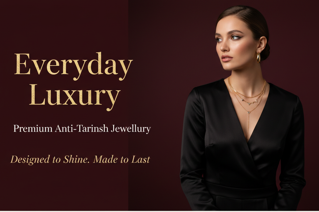 generate a deep meroon hero banner image with a  model in black outfit wearing minimal gold plated jewellery, gold plated layered necklace and hoops .Add elegant luxury text overlay on the left side:
Large refined serif font in metallic gold:
“Everyday Luxury”
Smaller clean sans-serif font below in soft gold/cream:
“Premium Anti-Tarnish Jewellery”
Elegant italic serif tagline in muted gold:
“Designed to Shine. Made to Last.”
